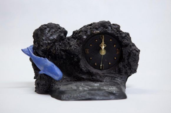 Basalt stone clock with map and dolphin application